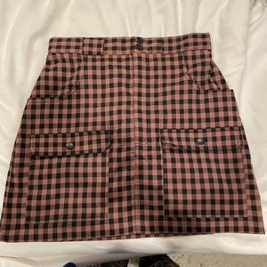 Urban outfitters mini skirt. Zips and buttons in the front. Size S.